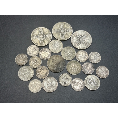 2314 - A collection of British silver coins to include eight 92.5% threepences, three 50% florins, six 50% ... 