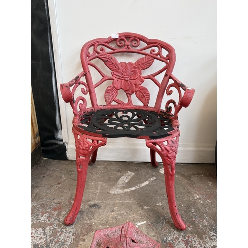 209A - Two red painted cast iron garden items, one Oriental style pagoda lantern - approx. 27cm high and on... 
