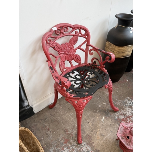 209A - Two red painted cast iron garden items, one Oriental style pagoda lantern - approx. 27cm high and on... 