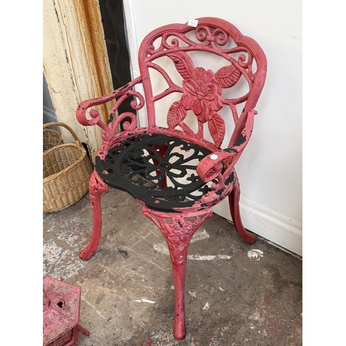 209A - Two red painted cast iron garden items, one Oriental style pagoda lantern - approx. 27cm high and on... 