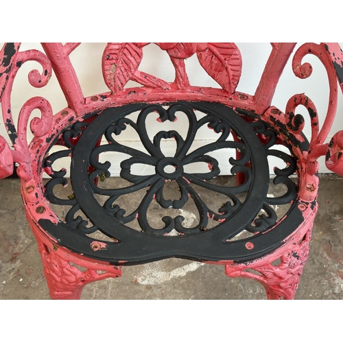 209A - Two red painted cast iron garden items, one Oriental style pagoda lantern - approx. 27cm high and on... 