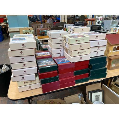 Ninety-four Wentworth wooden jigsaw puzzles, five 500 piece, eighty 250 piece, six 200 piece, one 140 piece and two unmarked; titles to include Bookshop, Tea Room, Times Square, Baltimore Bride Quilt, Salcombe, Battle of Britain Memorial Flight, The Birth of Endeavour, Café de Parisien etc.