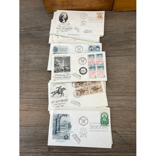 Three wooden boxes containing 1940s, 1950s and 1960s first day covers