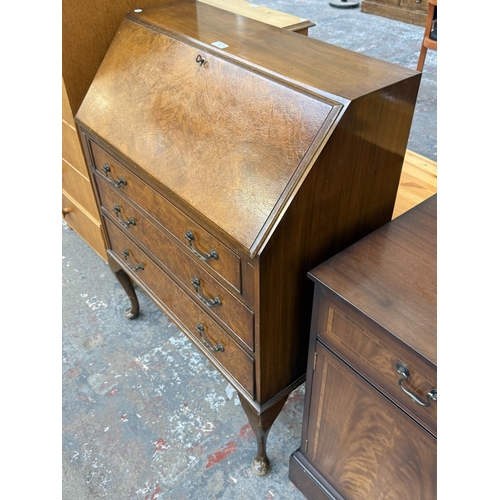 16 - A Georgian style walnut and mahogany bureau on cabriole supports - approx. 101cm high x 77cm wide x ... 