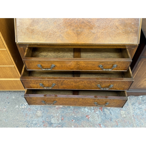 16 - A Georgian style walnut and mahogany bureau on cabriole supports - approx. 101cm high x 77cm wide x ... 