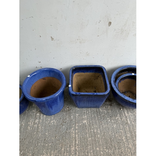 26 - Eight blue glazed garden planters - largest approx. 40cm diameter