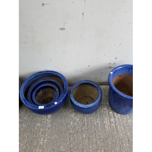 26 - Eight blue glazed garden planters - largest approx. 40cm diameter