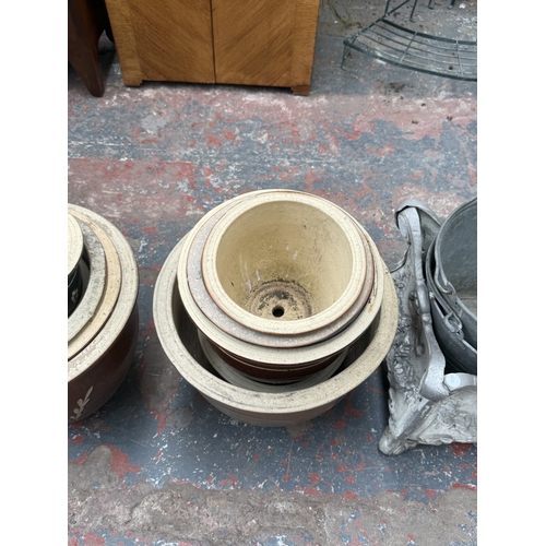35 - Fifteen items, one terracotta chimney pot, two galvanised buckets, one 19th century style cast metal... 