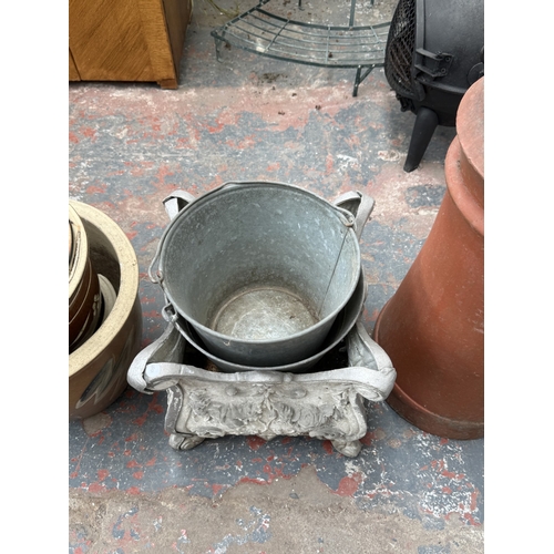 35 - Fifteen items, one terracotta chimney pot, two galvanised buckets, one 19th century style cast metal... 