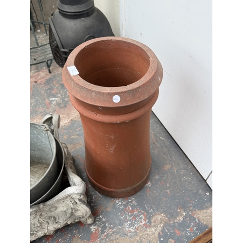 35 - Fifteen items, one terracotta chimney pot, two galvanised buckets, one 19th century style cast metal... 
