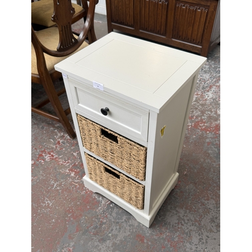 6 - A modern white painted bedside cabinet with two wicker basket drawers - approx. 70cm high x 38cm wid... 