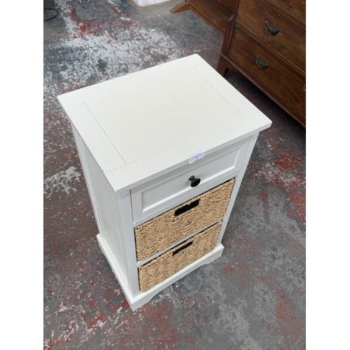 6 - A modern white painted bedside cabinet with two wicker basket drawers - approx. 70cm high x 38cm wid... 