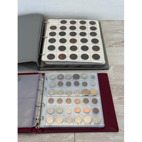 Two coin albums containing a collection of world coins; silver examples ...