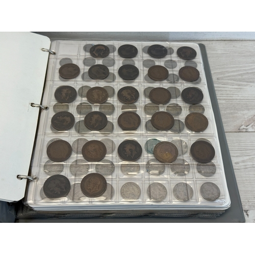 Two coin albums containing a collection of world coins; silver examples ...