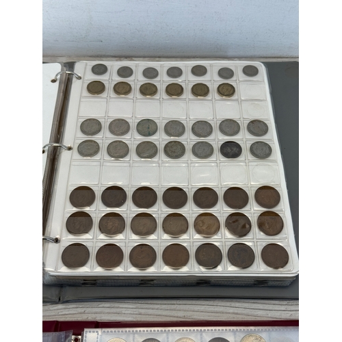 Two coin albums containing a collection of world coins; silver examples ...