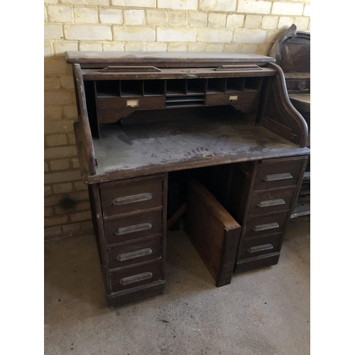 101 - An early 20th century small oak roll top desk 105cm x 67cm x 120cm