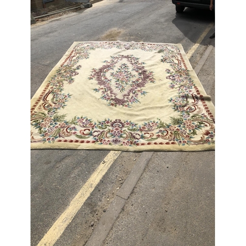 118 - A beige ground rug with floral pattern