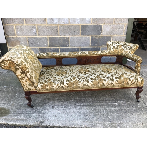 133 - A Edwardian 'Double ended' Chaise lounge upholstered in a gold fabric 177cm x 64cm x 72cm