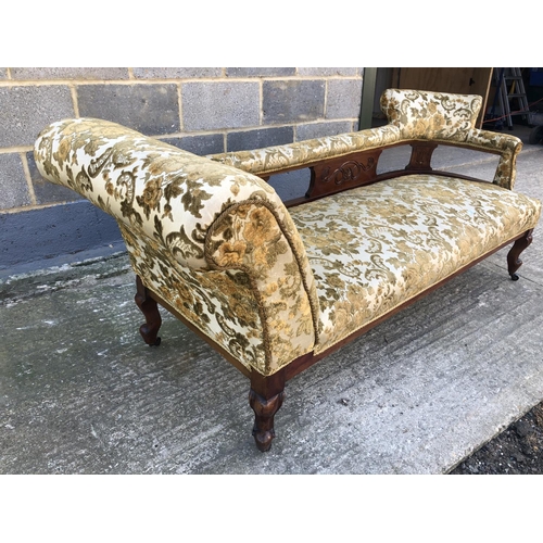 133 - A Edwardian 'Double ended' Chaise lounge upholstered in a gold fabric 177cm x 64cm x 72cm