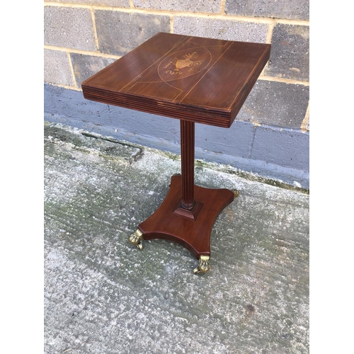 137 - A mahogany pedestal occasional table, inlaid top, corinthium column on brass casters 41cm x45cm x 72... 