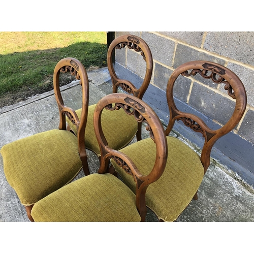 144 - A set of four Victorian balloon back chairs, with carved backs and gold upholstered seats