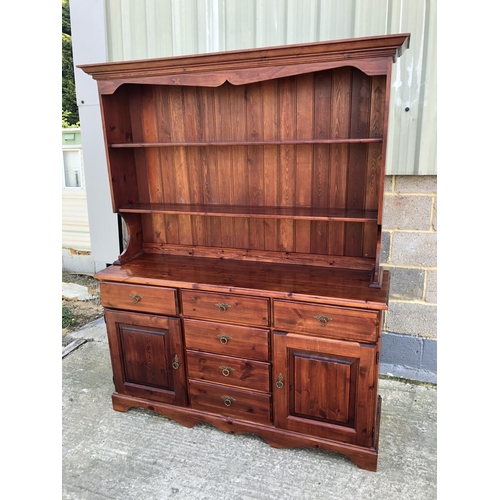 148 - A Modern Stained Pine dresser shelved top section, over three drawers and cupboard base 152cm x 45cm... 