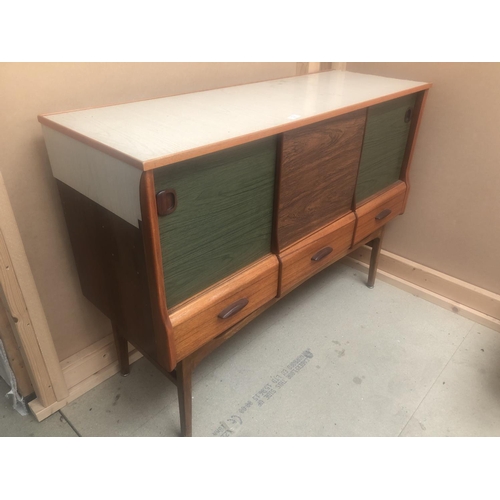 160 - A 1960's Teak sideboard in the style of Kandya, with Formica panel doors 123cm x 42cm x 90cm