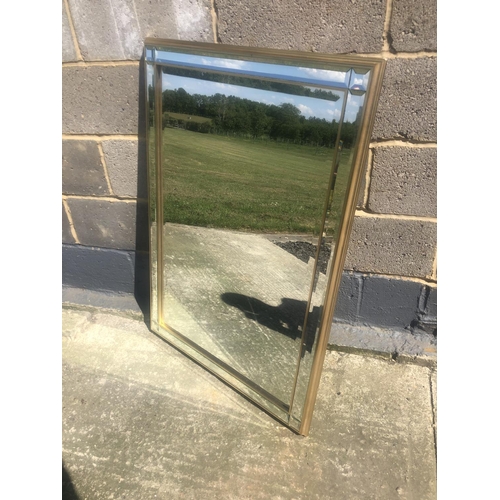 165 - A large mirror with a bevelled mirror frame