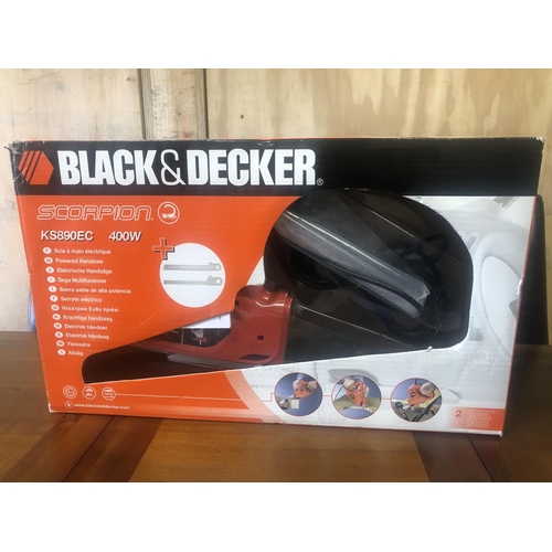 175 - A black and decker scorpion sabre saw, still boxed