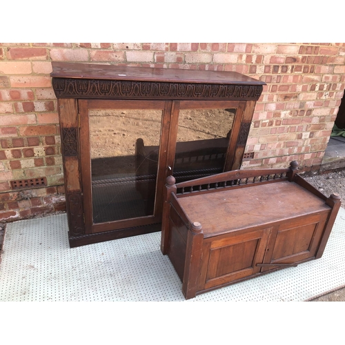 32 - Glazed Mahogany bookcase with carved decoration, together with a mahogany cupboard