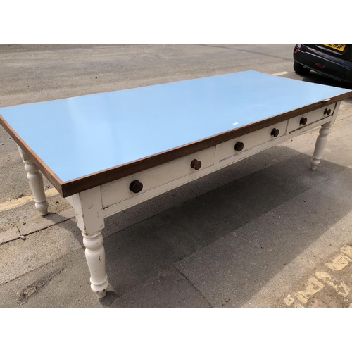 54 - A huge painted pine country house kitchen table, Formica top, 3 drawers to each side on solid pine l... 