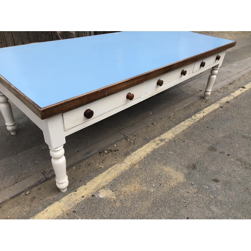 54 - A huge painted pine country house kitchen table, Formica top, 3 drawers to each side on solid pine l... 