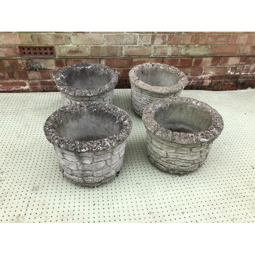 59 - A set of four cast concrete garden planters with a brick pattern. each measure 36cm round 28cm high