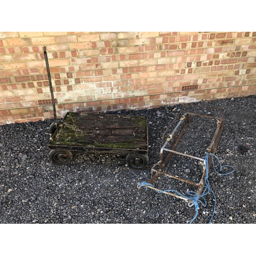 76 - A vintage iron hand barrow together with an iron sledge frame