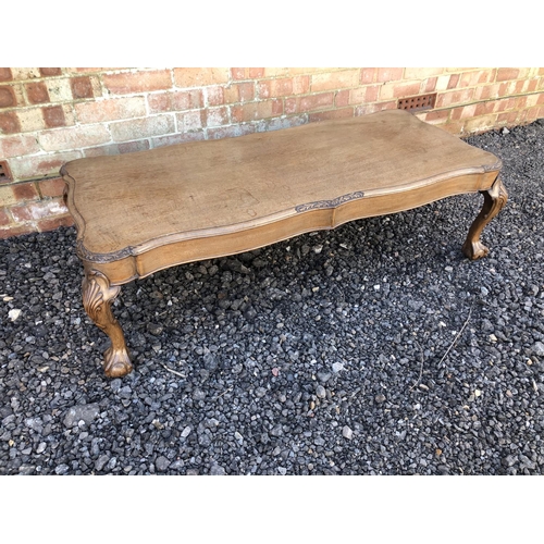 87 - A reproduction queen Anne style coffee table with ball and claw feet 150cm x 53m x36cm