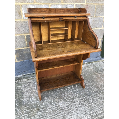1 - A small oak roll top desk 75x56x114cm