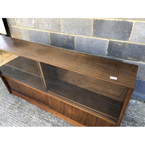 10 - A 1950's glazed bookcase cabinet 152w x 24d x 84h