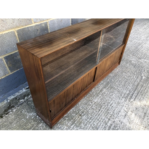 10 - A 1950's glazed bookcase cabinet 152w x 24d x 84h