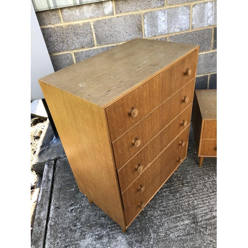 13 - A Light oak G plan stlye bedroom pair, comprising of a chest of five drawers and a two drawer dressi... 