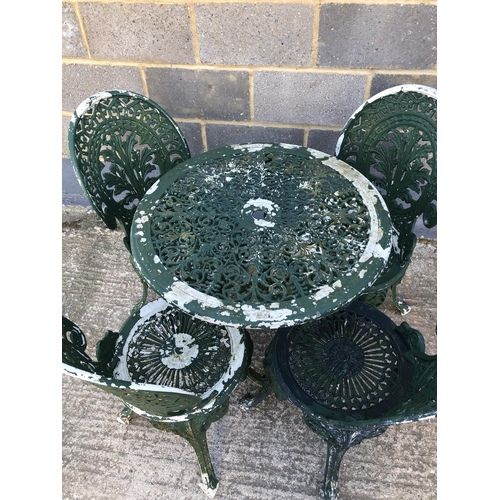 14 - An aluminium garden table and four chairs 70cm diameter