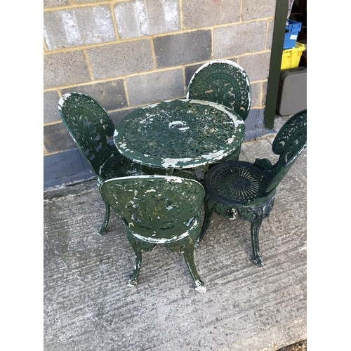 14 - An aluminium garden table and four chairs 70cm diameter