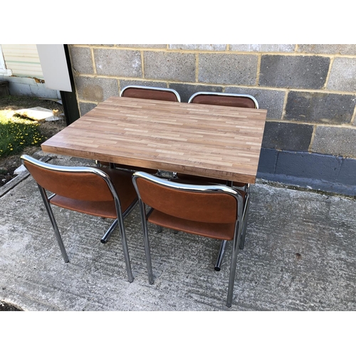 33 - A vintage chrome kitchen table with formica top, togeter with 4 matching chairs 70 x 100cm