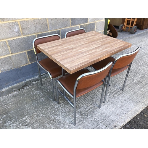 33 - A vintage chrome kitchen table with formica top, togeter with 4 matching chairs 70 x 100cm