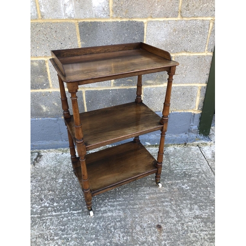 34 - A rosewood three tier buffet with gallery top 54 x36 x 89cm