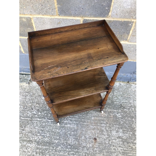 34 - A rosewood three tier buffet with gallery top 54 x36 x 89cm