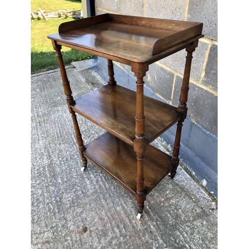 34 - A rosewood three tier buffet with gallery top 54 x36 x 89cm