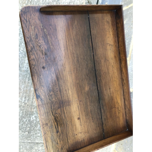 34 - A rosewood three tier buffet with gallery top 54 x36 x 89cm