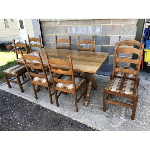 36 - A continental oak refectory style dining table on X frame base with 8 dining chairs . Table top: 160... 