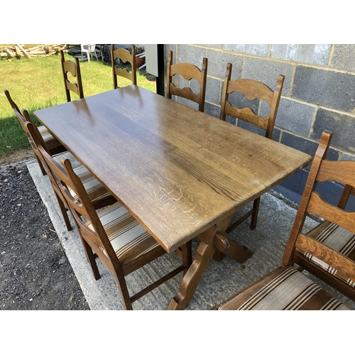 36 - A continental oak refectory style dining table on X frame base with 8 dining chairs . Table top: 160... 