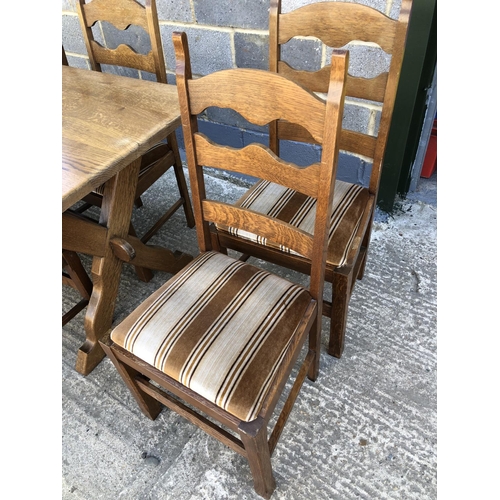 36 - A continental oak refectory style dining table on X frame base with 8 dining chairs . Table top: 160... 